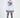 Back view of a man in the white Heartbit long-sleeve streetwear shirt with purple and black graphic art and gray jeans.