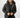 Man in black Philip Puffer Coat with faux fur trimmed hood over a black graphic tee and distressed blue jeans.