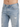 Close-up of blue distressed jeans showing front pocket and chain