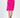 Model wearing the Brooke hot pink oversized knit sweater with trendy shoulder cut-outs and a mock neck.