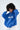 Model in blue ADOREYOU oversized hoodie with white text, distressed details, and white drawstrings.