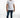Men's white Different Tee streetwear shirt with embroidered collar, layered hem, slim jeans, and white sneakers.