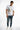 Model in Choose Your Future white graphic tee with blue streetwear jeans and sneakers in a studio setting.