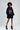 Model in an oversized black hoodie with a pink lips graphic print, ruched sleeves, and front pocket.