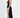 Kennedy black glitter maxi dress with a high side slit and spaghetti straps shown in a side profile view.