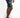 Side view of Otto blue distressed denim shorts for men featuring heavy rip details and paint splatter on white background.
