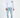 Model wearing Leon Light Blue Super Skinny Fit distressed jeans with a white hoodie and sneakers for a streetwear look.