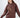 Woman wearing a brown NY graphic sweatshirt with 'Go As Far As You Can' text, featuring an oversized streetwear fit.