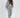 LILY JACKET SET: Woman wearing a light grey matching lounge set with hooded zip jacket and drawstring jogger pants.