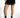 Model wearing Carbon black high-waisted Carly denim shorts with distressed cutouts and silver chain details.