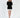 Model wearing a Celine black turtleneck knit sweater with a distressed fringe hem, paired with a white skirt.