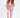 Model in Remi Jacket Set featuring a salmon pink oversized hoodie, matching joggers, and cutout bodysuit.