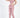 A model poses in a pink cut-out bodysuit and matching joggers, styled with white sneakers.