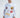 Model wearing the Untimely white long-sleeve streetwear shirt featuring pixel art graphics and colorful urban prints.