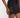Close-up of black Gyda matching set skirt featuring gold eyelets and side lace-up detail for women's streetwear.