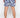 Back view of Hank Swimwear's blue floral patterned swim trunks with white tropical leaf prints and elastic waistband.