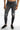 Men's Carbon Zayn slim fit grey denim jeans with distressed knee details and a tapered leg on model.
