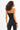 Back view of a woman wearing the Carbon ribbed one-shoulder sleeveless crop top with double strap detail and leggings.