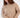 Serena beige cable knit turtleneck sweater featuring an oversized fit and rib-knit cuffs on a female model.