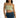 Model in Bailey sage green ribbed crop tank top with spaghetti straps and dark wash distressed denim jeans.