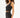 Model wearing a black ribbed one-shoulder sleeveless crop top with high-waisted pants by Carbon.