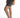 Side view of Maxine grey washed denim high-waisted shorts with horizontal seam detail and white sneakers.
