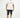 Model in Samuel black washed denim shorts with distressing and a white graphic tee against a studio background.