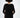 Back view of the Lilith Sweater in black ribbed knit with cream accents and a comfortable, oversized fit.