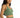 Side view of Nia Knit Cami in green, featuring a ribbed V-neck cropped design on model.
