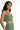 Side view of Nia Knit Cami in green, featuring a ribbed V-neck cropped design on model.