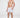 Model wearing Walker sailboat patterned swim trunks and white slides, showcasing a trendy men's summer beachwear look.