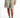 Vera Grey high-waisted tailored linen suit shorts with a removable belt and pleated front, worn with white sneakers.
