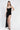 Kennedy black glitter maxi dress with a sweetheart neckline and ultra-high thigh slit for women.