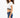 Side view of a model in a white cropped tee with a striped elastic hem and blue slim-fit jeans against a white backdrop.