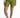 Karina high-waisted olive green biker shorts on model, featuring a compressive fit and white sneakers.