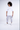 Man wearing a white oversized Fine Arts graphic streetwear shirt with light grey cargo pants and white sneakers.