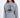 Woman in an oversized light grey Sailing Top with a black circular ship graphic, a modern streetwear essential.