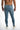 Back view of Carbon Jairo blue washed skinny jeans for men with distressed streetwear details and a branded waist patch.