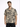 A man wearing a short-sleeve, patterned shirt with abstract black and beige designs, standing against a white backgro...