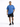 A man wearing a blue oversized t-shirt with a graphic text design, paired with black shorts and sneakers.