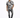 A man walks confidently in a short-sleeve, abstract-patterned shirt paired with distressed jeans and black sneakers.