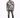 A man stands confidently in a short-sleeve, black and white patterned shirt paired with distressed jeans.