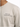 Light beige t-shirt featuring black text that reads "Life Is An Unpredictable Game" on the chest.