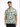 A man models a short-sleeve, patterned shirt featuring green and beige geometric designs.