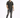 A man stands confidently in a short-sleeve, striped shirt paired with distressed gray jeans and black sneakers.