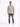 A man stands confidently in a short-sleeve striped shirt with beige, blue, and brown tones, paired with distressed je...