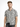 A man wearing a short-sleeve shirt with a black and white square pattern, paired with dark jeans.