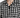 Short-sleeve shirt featuring a black and white grid pattern with a classic collar and button closure.