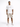 A man stands confidently in a white oversized t-shirt and beige cargo shorts, paired with white sneakers.