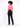 A model with curly hair wears a short-sleeve pink top and black pants, posing from the back against a light background.